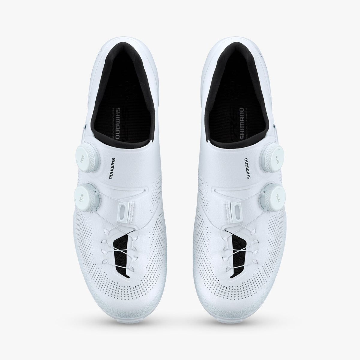 Pair of white S-PHYRE SH-RX910 cycling shoes with dual dial closures and black insoles