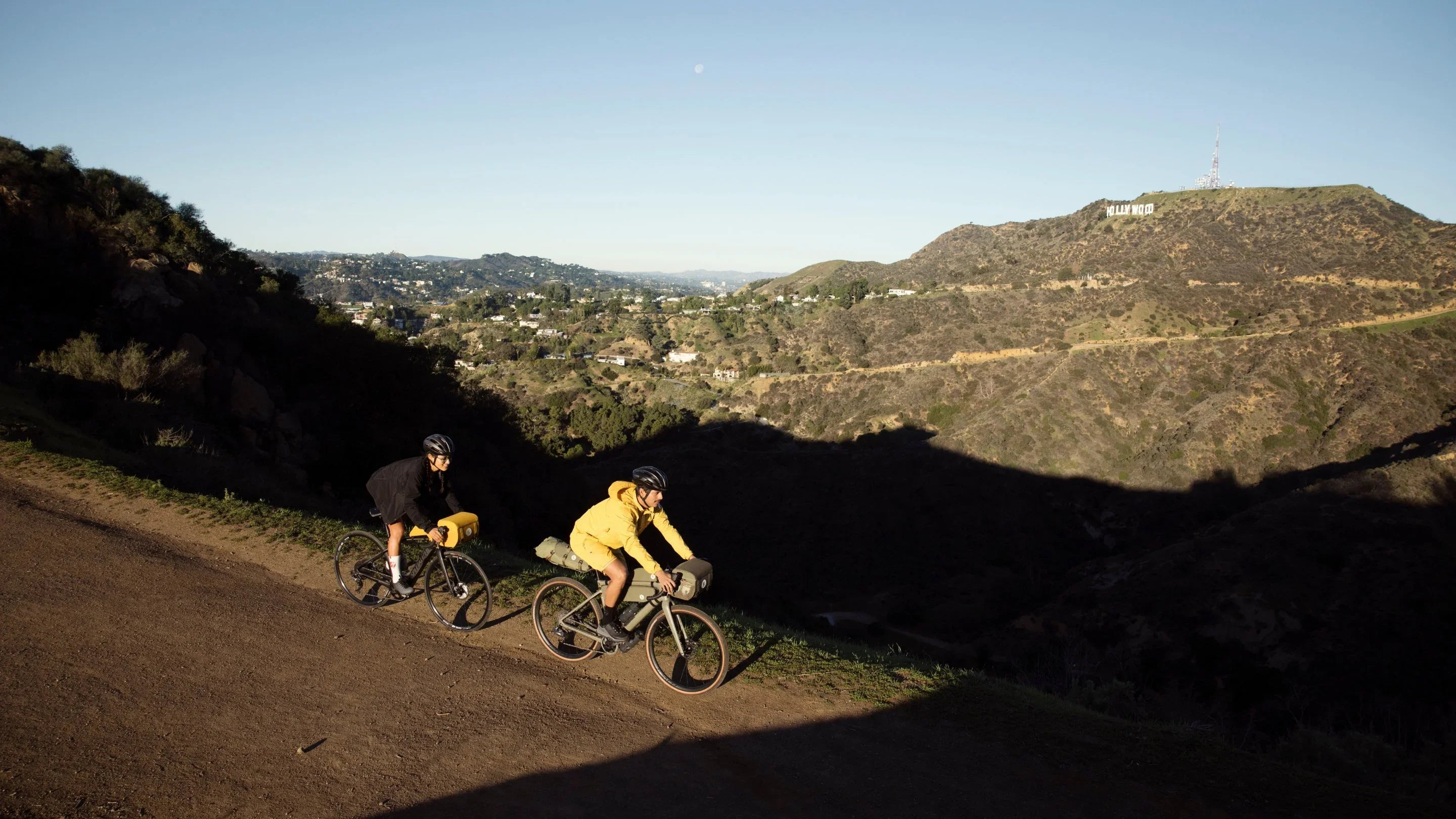 "Durable bicycle trunk bag securely attached to a rear bike rack, featuring multiple compartments and reflective accents for visibility