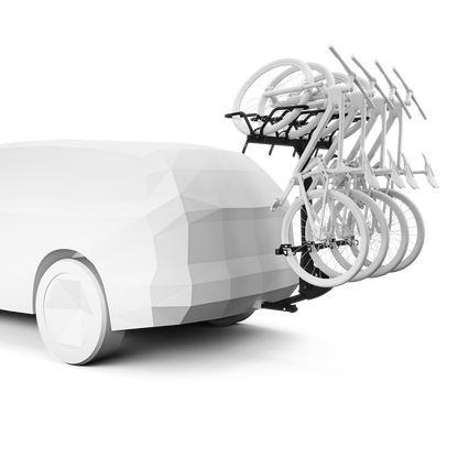 White pickup with hitch-mounted rack holding multiple bikes