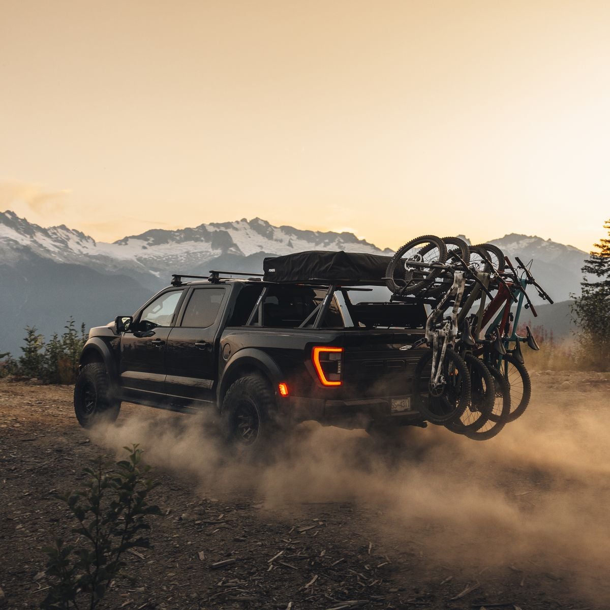 Hitch bike rack installed on a pickup truck carrying multiple bikes
