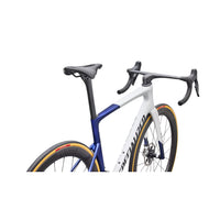 Road bike frame close-up, blue-and-white with black seatpost and handlebars