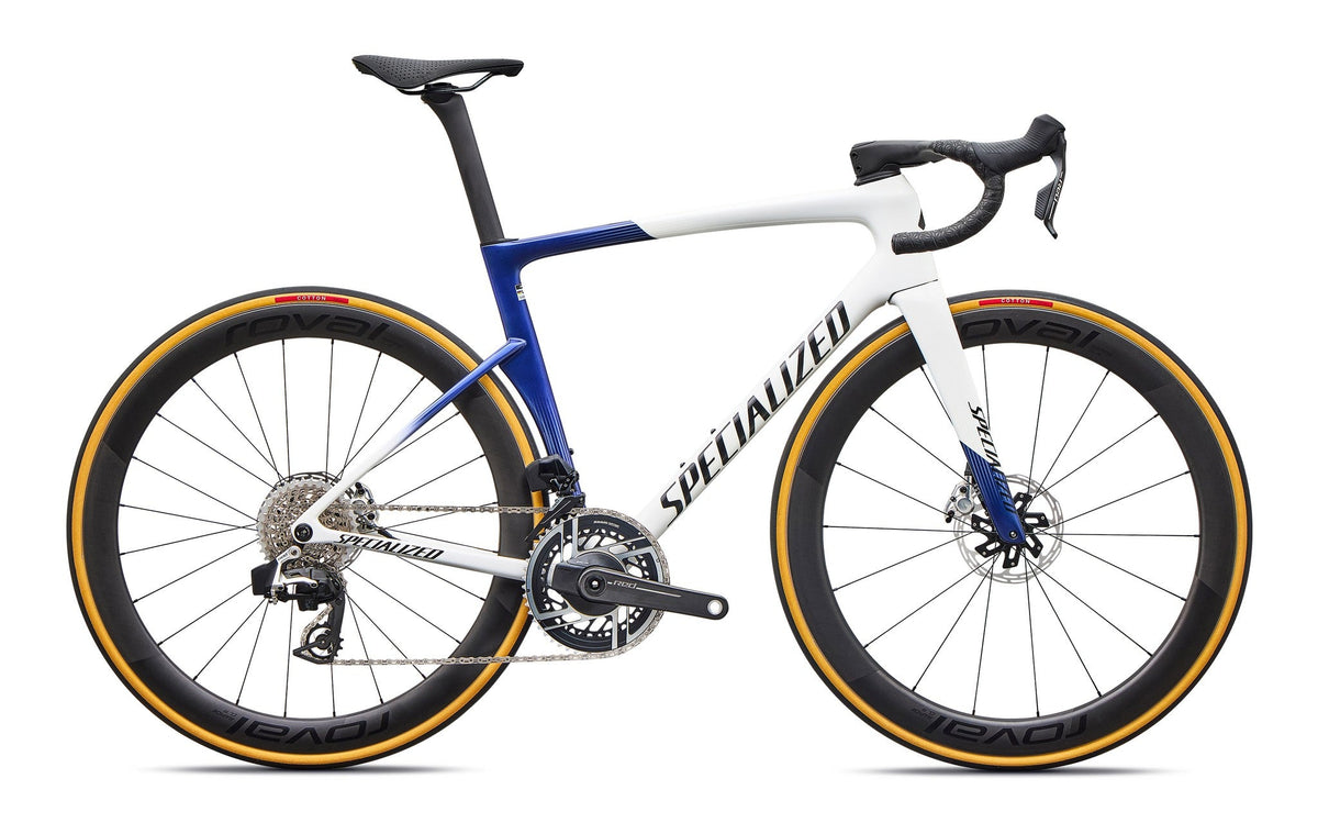 White and blue road bicycle with disc brakes, aero handlebars, and gold-rim wheels