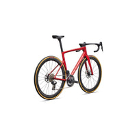 Red road bike side view with disc brakes, black bar tape, and aerodynamic frame