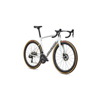 White road bike in profile with aero handlebars, disc brakes, and orange-rim tires