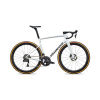 White aero road bike from side view with disc brakes and orange-trim wheel rims