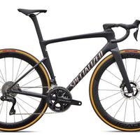 Black road bike with aero frame, drop handlebars, disc brakes, and orange-rim tires