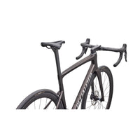 Road bike front half with dark gray frame and textured black handlebars