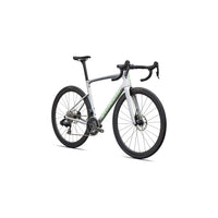 Silver road bike with black wheels and fork, green stripe along down tube