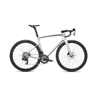 Silver road bike with black wheels and disc brakes, green accent stripe on frame