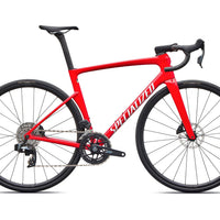 Vivid red road bike with drop handlebars, aero frame, and disc brakes