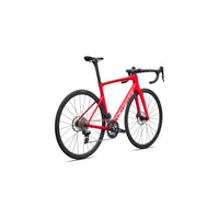 Red aero road bike front three-quarter view, drop handlebars, disc brakes