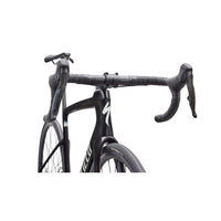 Charcoal road bike close-up of handlebars and front area with compact head tube