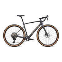 Gravel road bike with dark gray frame, black drop handlebars, disc brakes, tan tire trim