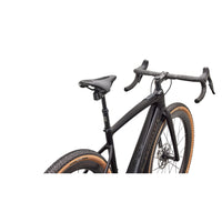 S-Works road e-bike, close-up of saddle and handlebars with orange-banded tires