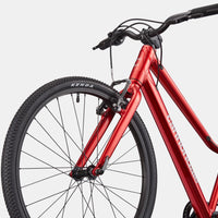 Kids red bike frame and front wheel with black fork and handlebar