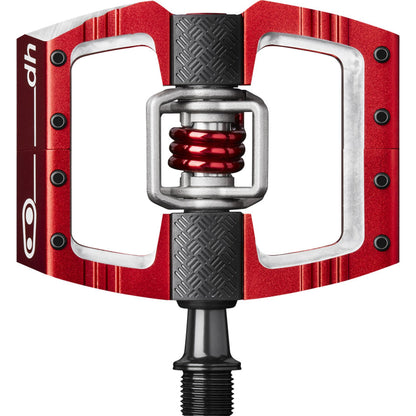 Red downhill bicycle pedal with black grip pads and red spring core