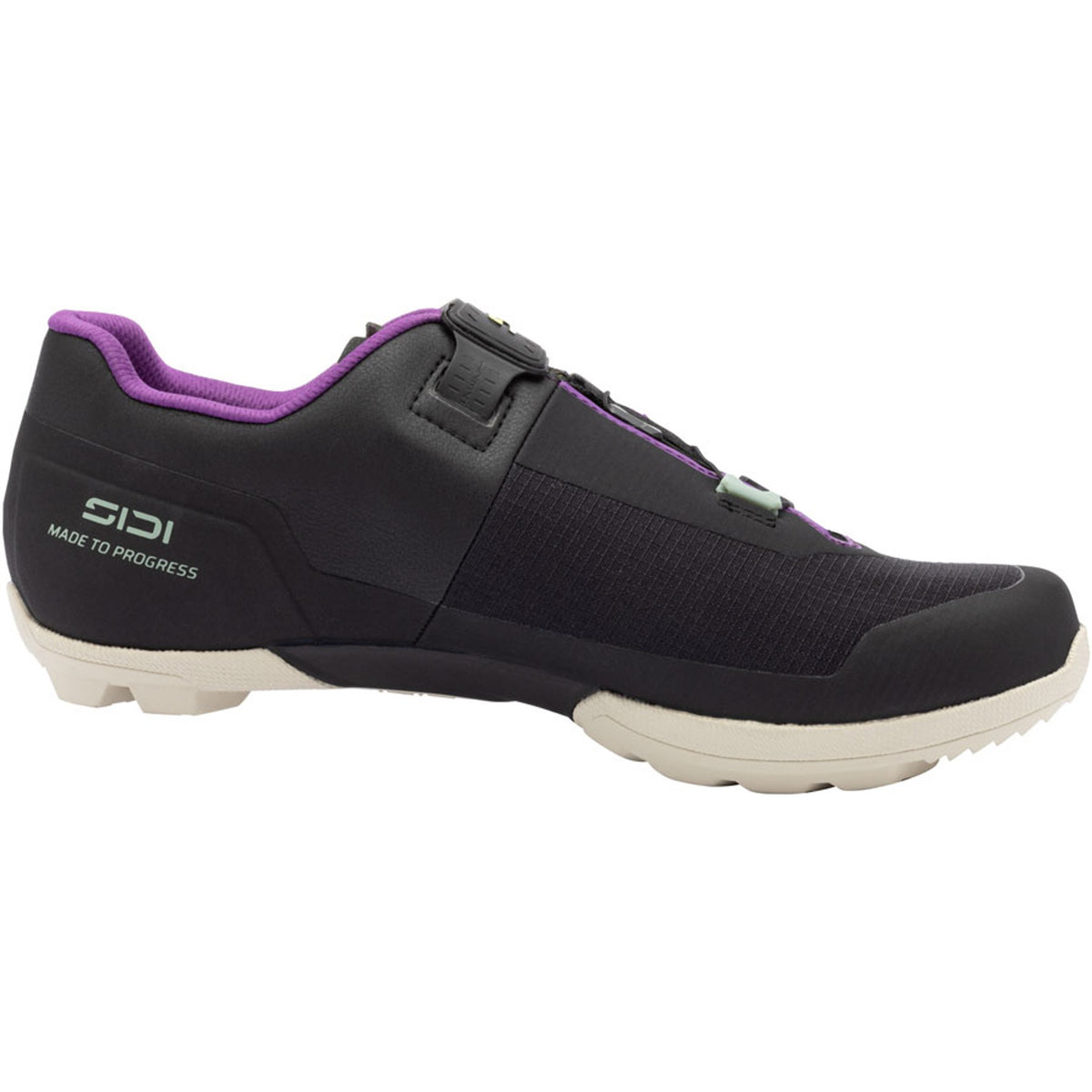 Black gravel cycling shoe with purple lining, hook-and-loop strap, and white sole