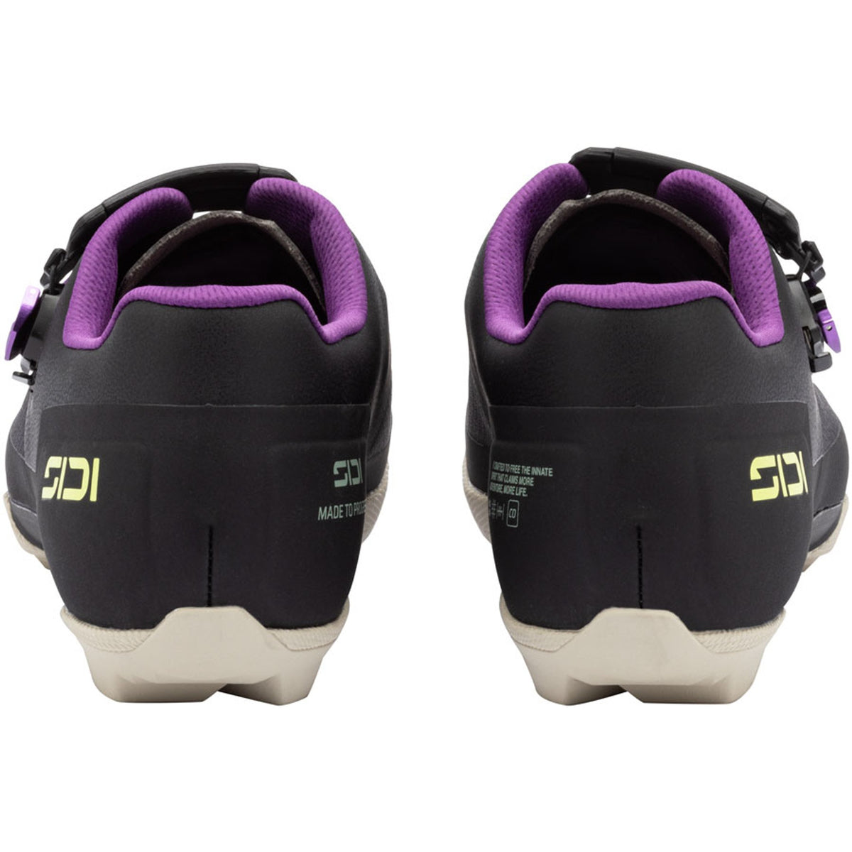 Black gravel cycling shoe with purple padded collar and white sole, rear view