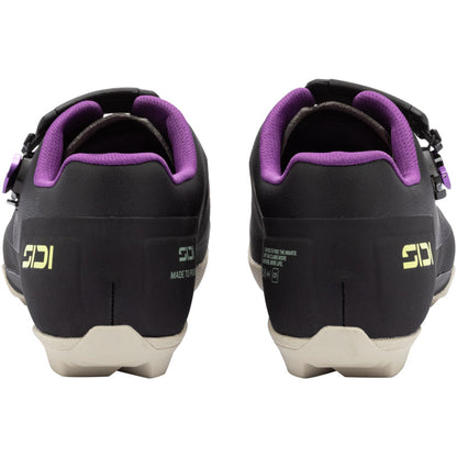 Black gravel cycling shoe with purple padded collar and white sole, rear view