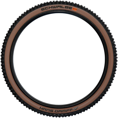 Hans Dampf Tire - 27.5 x 2.6 Tubeless Folding BLK/Bronze Evolution Line Super Trail Addix Soft - Bicycle Warehouse