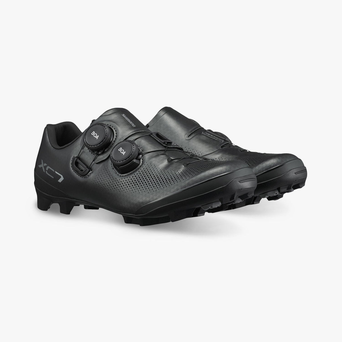 Black cycling shoes with BOA dials and perforated upper
