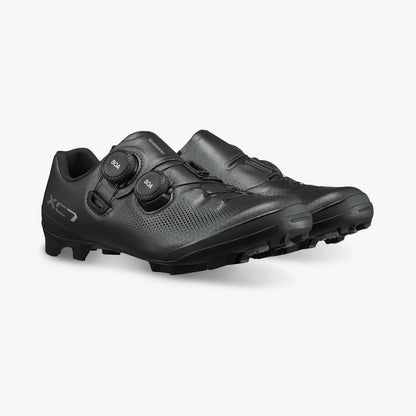 Black cycling shoes with BOA dials and perforated upper