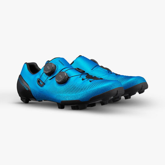 Blue S-PHYRE cycling shoes with dual dial closures and black lugged soles