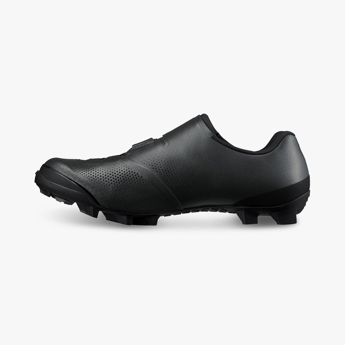 Black cycling shoes, side view with perforated toe and rugged tread sole