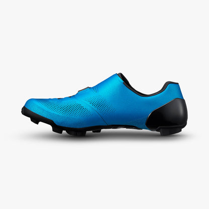 Side view of a blue S-PHYRE cycling shoe with a black heel and lugged sole