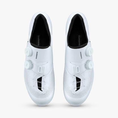 Pair of white S-PHYRE SH-RX910 cycling shoes with dual dial closures and black insoles