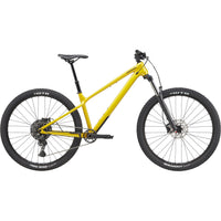 Yellow hardtail mountain bike with front suspension and disc brakes, side view
