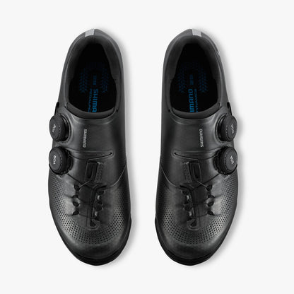 Pair of black cycling shoes with dual BOA dials and perforated toe