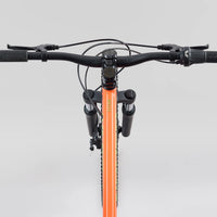 Storm 24 orange bike handlebar and stem with front suspension and brake levers