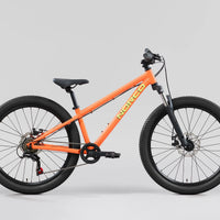Storm 24 orange mountain bike three-quarter view with knobby tires and disc brakes