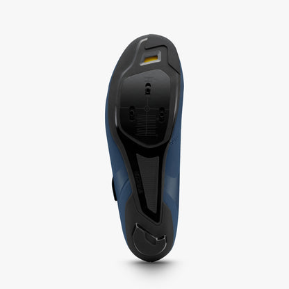 Navy-and-black shoe outsole with deep tread and vent cutouts on heel