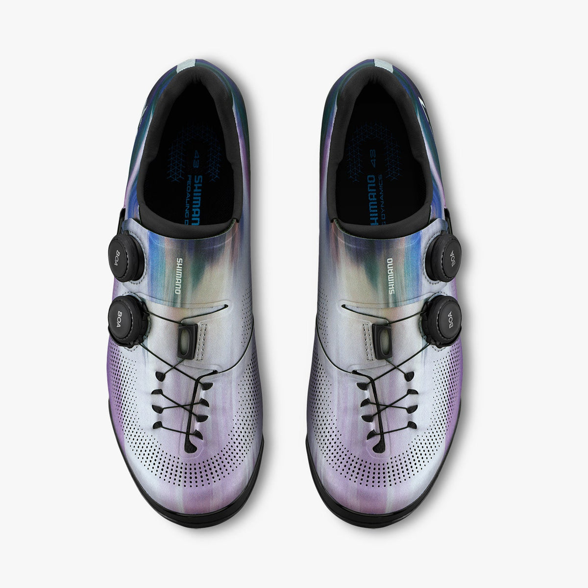 Pair of silver iridescent cycling cleat shoes with perforated toe and strap closures