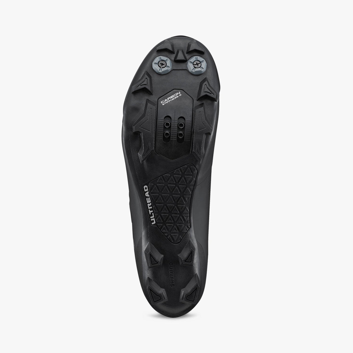 Black cycling shoe outsole with molded traction studs and cleat mounting points