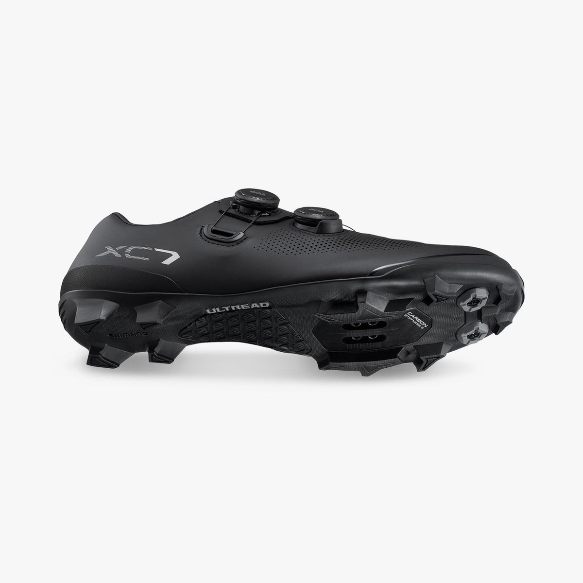 Black cycling cleat shoe side view with cleat plate and studded heel outsole